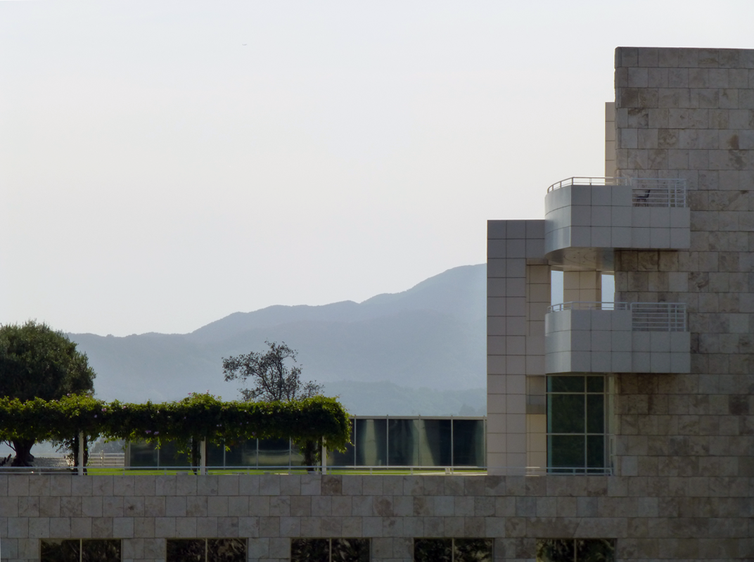 the slope of a getty center structure as it mirrors the mountain on the other side